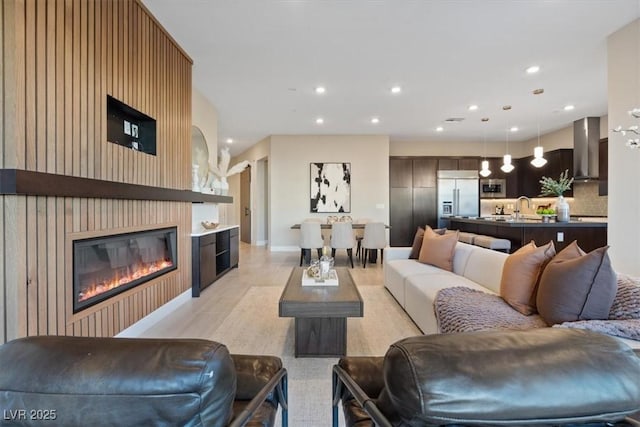 120 Los Cabos Dr Unit 301, Las Vegas, NV 89144 - living room featuring a glass covered fireplace and recessed lighting