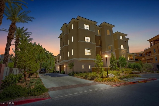 120 Los Cabos Dr Unit 301, Las Vegas, NV 89144 - property at dusk featuring concrete driveway