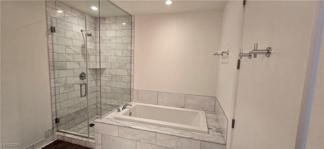 4471 Dean Martin Dr Unit 1104, Las Vegas, NV 89103 - full bathroom featuring a shower stall, a garden tub, and recessed lighting