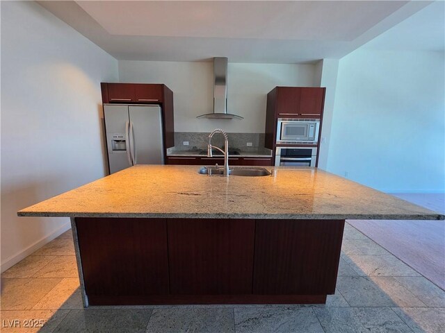 4471 Dean Martin Dr Unit 1104, Las Vegas, NV 89103 - kitchen with stainless steel appliances, wall chimney exhaust hood, light stone countertops, and modern cabinets