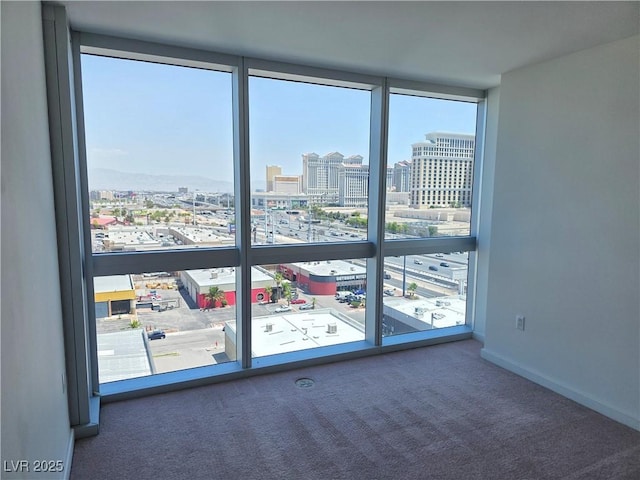4471 Dean Martin Dr Unit 1104, Las Vegas, NV 89103 - carpeted spare room with a view of city and expansive windows
