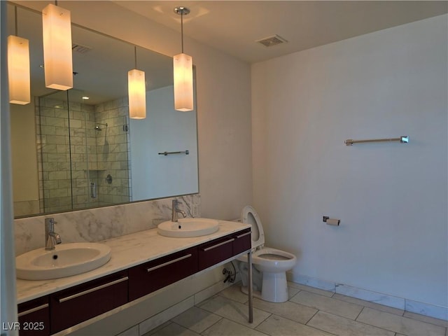 4471 Dean Martin Dr Unit 1104, Las Vegas, NV 89103 - bathroom with a stall shower, double vanity, and tile patterned flooring