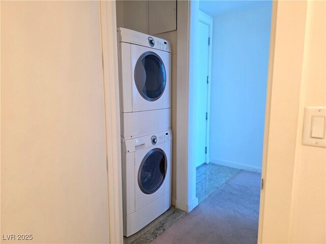 4471 Dean Martin Dr Unit 1104, Las Vegas, NV 89103 - laundry area with stacked washing machine and dryer and light carpet