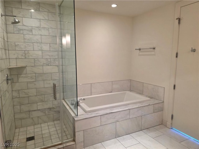 4471 Dean Martin Dr Unit 1104, Las Vegas, NV 89103 - bathroom with a bath, a shower stall, recessed lighting, and tile patterned floors