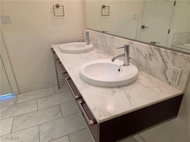 4471 Dean Martin Dr Unit 1104, Las Vegas, NV 89103 - bathroom with double vanity and tasteful backsplash
