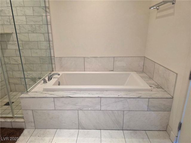 4471 Dean Martin Dr Unit 1104, Las Vegas, NV 89103 - bathroom with a garden tub, a stall shower, and tile patterned floors