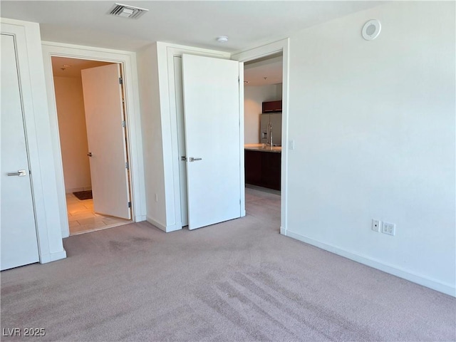 4471 Dean Martin Dr Unit 1104, Las Vegas, NV 89103 - unfurnished bedroom featuring stainless steel refrigerator with ice dispenser and carpet floors