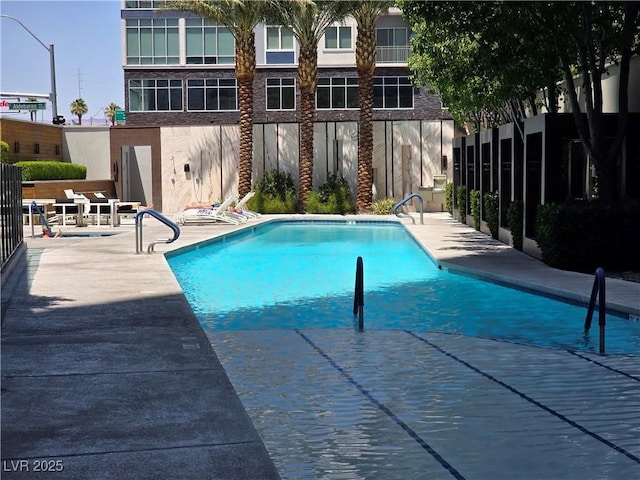 4471 Dean Martin Dr Unit 1104, Las Vegas, NV 89103 - community pool with a patio area