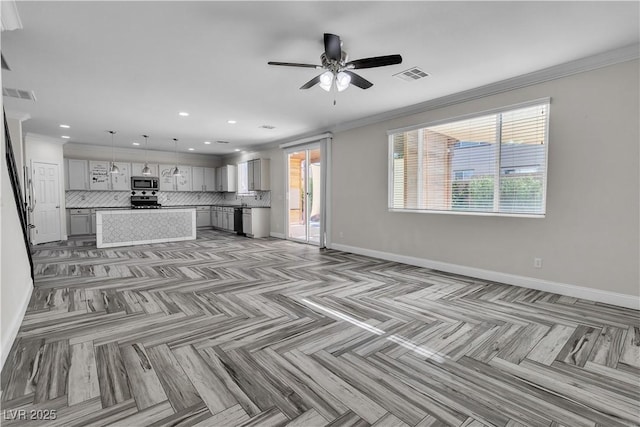 5425 Pride Mountain St, North Las Vegas, NV 89031 - unfurnished living room featuring a ceiling fan, recessed lighting, and crown molding