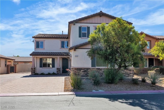 5425 Pride Mountain St, North Las Vegas, NV 89031 - view of front of property with stone siding, stucco siding, and a tile roof