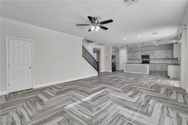 5425 Pride Mountain St, North Las Vegas, NV 89031 - unfurnished living room with stairs, a ceiling fan, recessed lighting, and crown molding