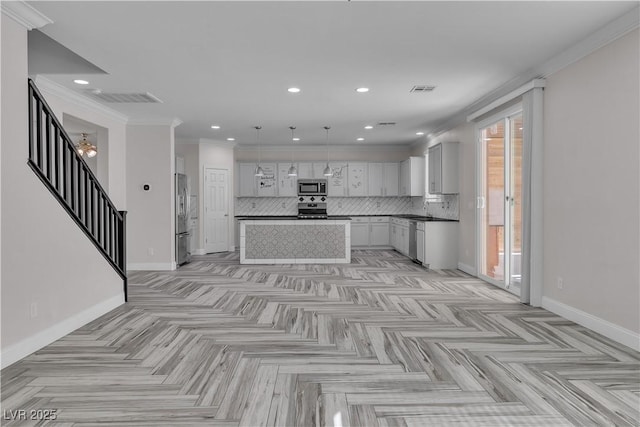 5425 Pride Mountain St, North Las Vegas, NV 89031 - kitchen featuring appliances with stainless steel finishes, tasteful backsplash, recessed lighting, hanging light fixtures, and a center island