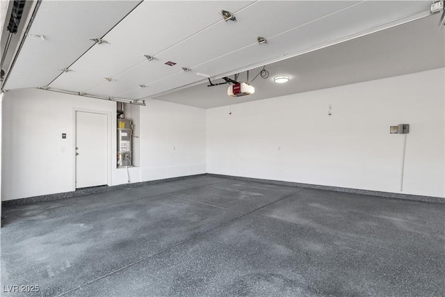 5425 Pride Mountain St, North Las Vegas, NV 89031 - garage with a garage door opener and water heater