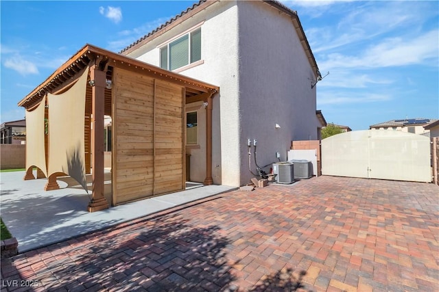 5425 Pride Mountain St, North Las Vegas, NV 89031 - back of property featuring stucco siding and a gate