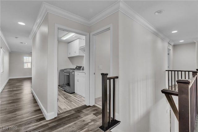 5425 Pride Mountain St, North Las Vegas, NV 89031 - corridor featuring an upstairs landing, washer and clothes dryer, dark wood finished floors, crown molding, and recessed lighting