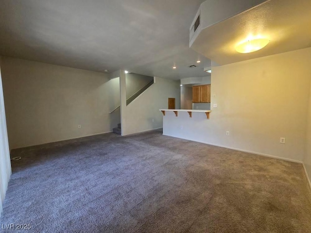 1739 N Lamont St, Las Vegas, NV 89115 - unfurnished living room with stairs, carpet floors, and recessed lighting
