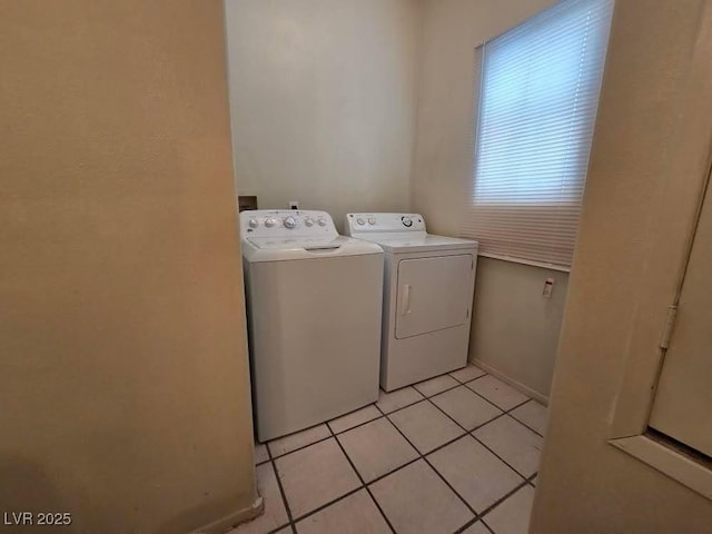 1739 N Lamont St, Las Vegas, NV 89115 - laundry area featuring washer and dryer and light tile patterned floors