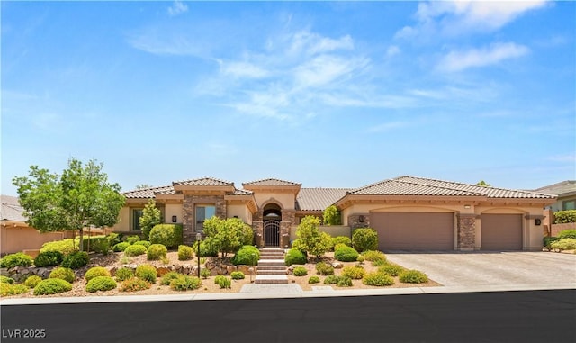 9747 Cathedral Pines Ave, Las Vegas, NV 89149 - mediterranean / spanish home with stucco siding, a tiled roof, concrete driveway, and an attached garage
