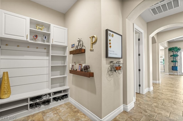 9747 Cathedral Pines Ave, Las Vegas, NV 89149 - mudroom with arched walkways and stone finish floors
