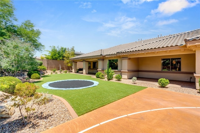 9747 Cathedral Pines Ave, Las Vegas, NV 89149 - rear view of house with a tile roof, stucco siding, and a patio area