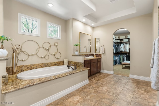 9747 Cathedral Pines Ave, Las Vegas, NV 89149 - full bathroom with vanity, a bath, and a spacious closet