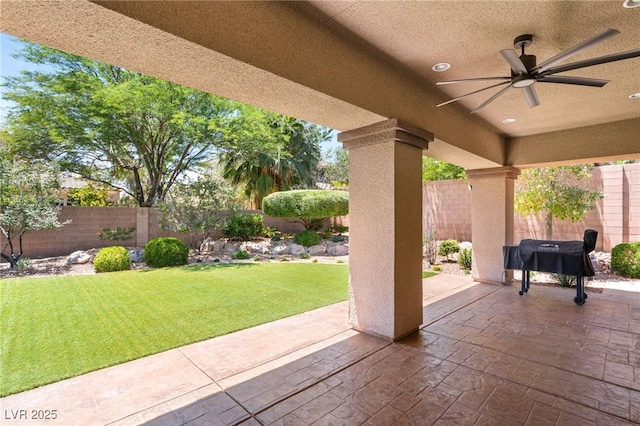 9747 Cathedral Pines Ave, Las Vegas, NV 89149 - fenced backyard with a patio area and a ceiling fan