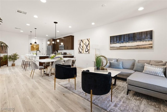 11756 Emerald Lake Ave, Las Vegas, NV 89138 - living room with light wood-style flooring and recessed lighting