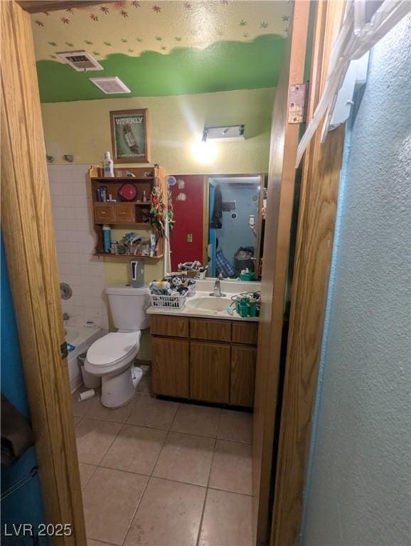 4238 Rollingstone Dr, Las Vegas, NV 89103 - bathroom featuring tile patterned flooring, vanity, and shower / bathtub combination