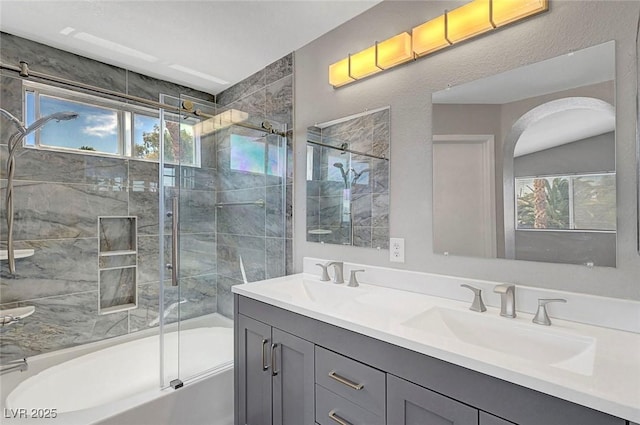 901 Carnival Ave, Las Vegas, NV 89123 - full bathroom featuring plenty of natural light, double vanity, and shower / bath combination with glass door