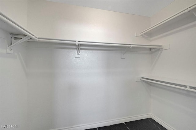 901 Carnival Ave, Las Vegas, NV 89123 - spacious closet with dark tile patterned floors