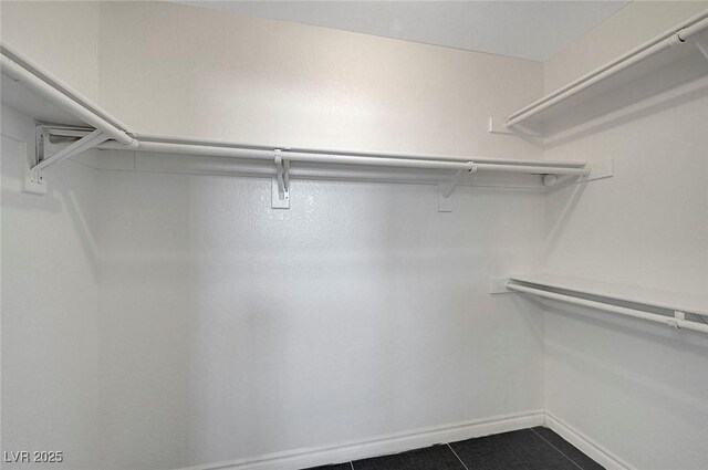 901 Carnival Ave, Las Vegas, NV 89123 - spacious closet with dark tile patterned floors