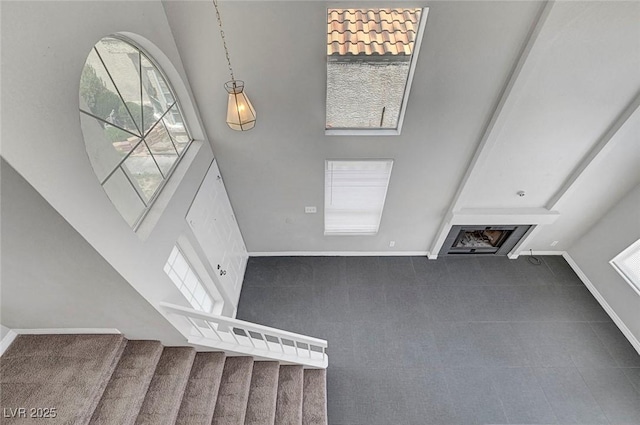 901 Carnival Ave, Las Vegas, NV 89123 - entrance foyer featuring a towering ceiling, stairway, carpet floors, and a fireplace
