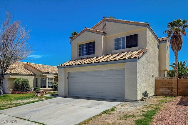 901 Carnival Ave, Las Vegas, NV 89123 - mediterranean / spanish-style home featuring a tile roof, stucco siding, a garage, and concrete driveway