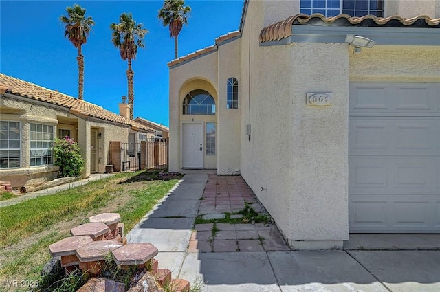901 Carnival Ave, Las Vegas, NV 89123 - doorway to property featuring stucco siding, a garage, and a gate
