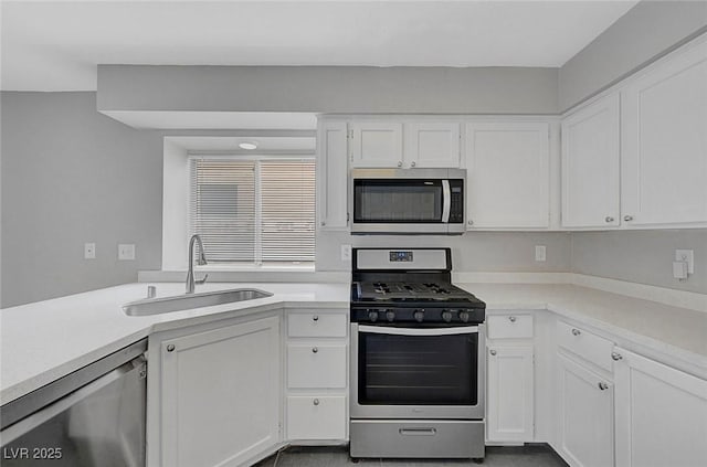 901 Carnival Ave, Las Vegas, NV 89123 - kitchen featuring stainless steel appliances, white cabinets, and light countertops