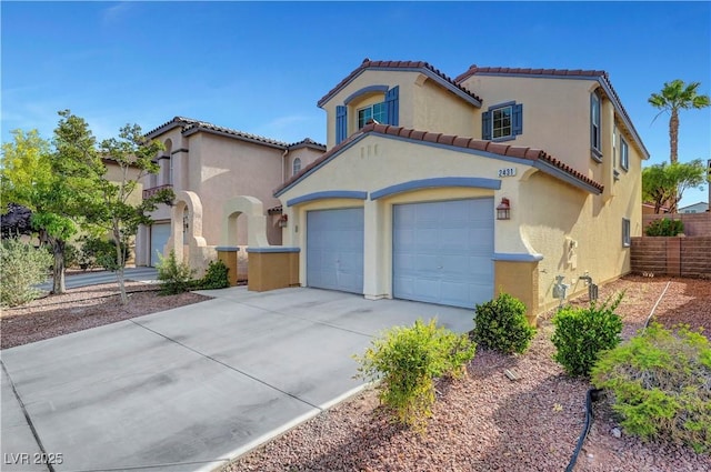 2431 Lilac Cove St, Las Vegas, NV 89135 - mediterranean / spanish-style home with concrete driveway, stucco siding, a tiled roof, and an attached garage