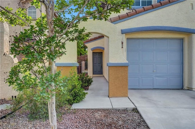 2431 Lilac Cove St, Las Vegas, NV 89135 - view of front of house with stucco siding, concrete driveway, and an attached garage