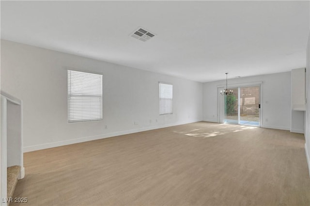 2431 Lilac Cove St, Las Vegas, NV 89135 - empty room featuring a chandelier and light wood-style flooring