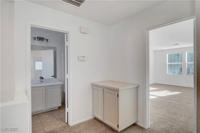 2431 Lilac Cove St, Las Vegas, NV 89135 - hall featuring light carpet and light tile patterned floors