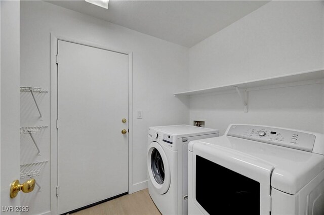 2431 Lilac Cove St, Las Vegas, NV 89135 - laundry room featuring washer and dryer and light wood-style floors