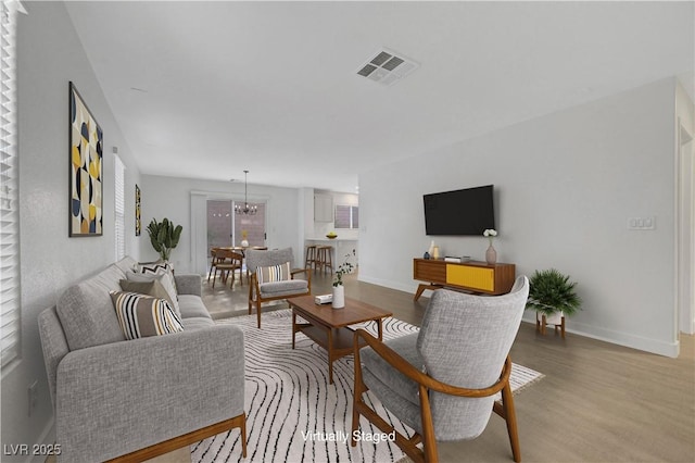 2431 Lilac Cove St, Las Vegas, NV 89135 - living area featuring wood finished floors and a chandelier