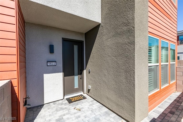 9844 Kings Glen St, Las Vegas, NV 89141 - doorway to property with stucco siding