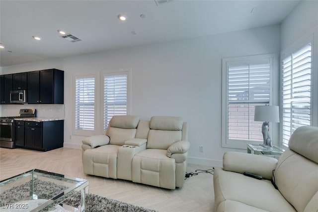 9844 Kings Glen St, Las Vegas, NV 89141 - living room with healthy amount of natural light and recessed lighting