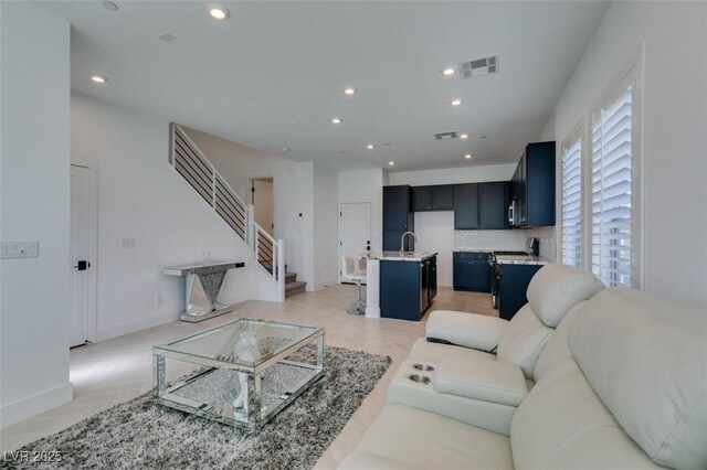 9844 Kings Glen St, Las Vegas, NV 89141 - living room with recessed lighting and stairs
