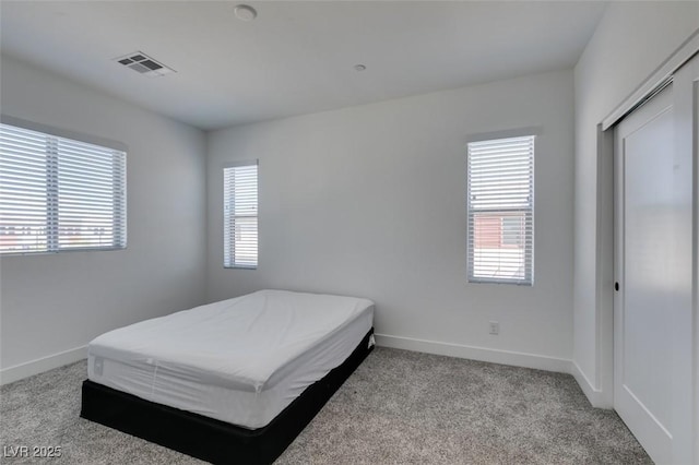 9844 Kings Glen St, Las Vegas, NV 89141 - carpeted bedroom featuring multiple windows and a closet