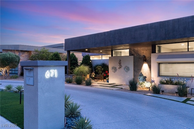671 Scenic Rim Dr, Henderson, NV 89012 - view of front of property with stucco siding