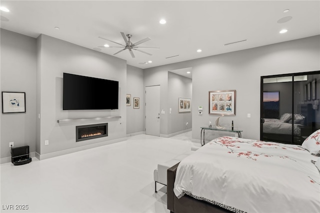 671 Scenic Rim Dr, Henderson, NV 89012 - bedroom featuring recessed lighting, a glass covered fireplace, and ceiling fan