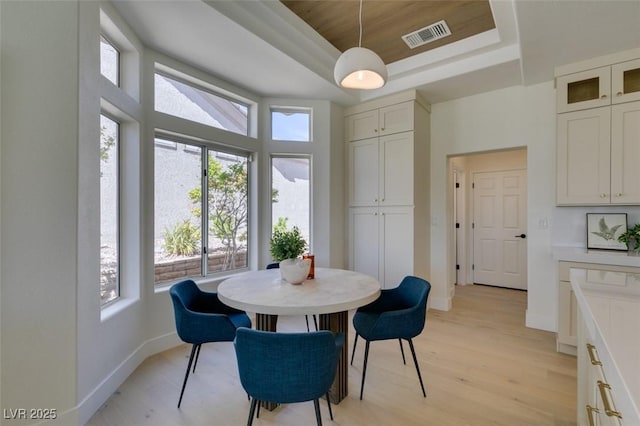 9425 Villa Ridge Dr, Las Vegas, NV 89134 - dining space with a raised ceiling and light wood finished floors