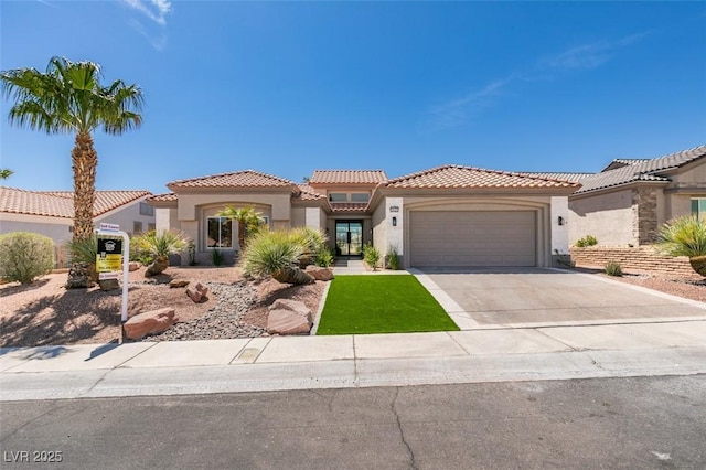 9425 Villa Ridge Dr, Las Vegas, NV 89134 - mediterranean / spanish house with stucco siding, a tile roof, a garage, and driveway