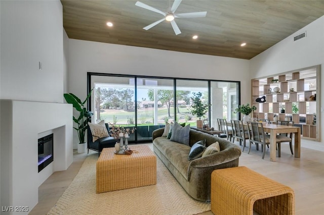 9425 Villa Ridge Dr, Las Vegas, NV 89134 - living area with healthy amount of natural light, ceiling fan, light wood-type flooring, recessed lighting, and a high ceiling